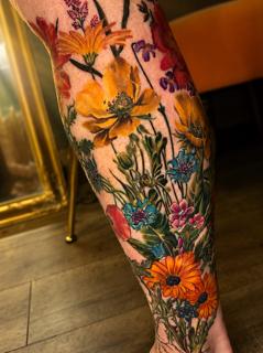 Realism floral bouquet tattoo by @eireink