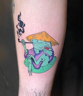 Illustrative smoking frog tattoo by @evi_ttt