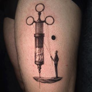 Illustrative syringe puppet tattoo by @void96_tattoo