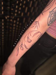 Fine line floral vine tattoo by @gee_tattoos_uk