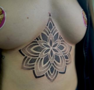 Dotwork mandala flower tattoo by @georgie_carville_tattoo