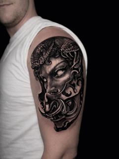 Blackwork medusa mask tattoo by @vanya.tattoo