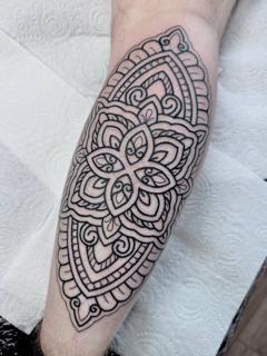 Ornamental mandala pattern tattoo by @greharptattoo