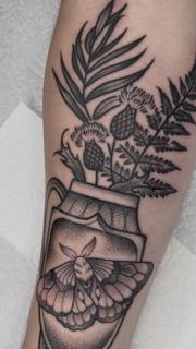 Blackwork moth and foliage tattoo by @greharptattoo