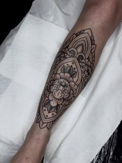 Ornamental ornamental flower tattoo by @greharptattoo