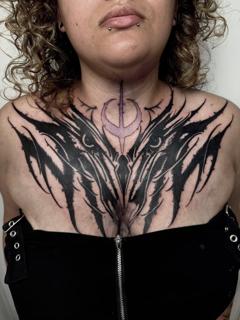 Blackwork abstract chest piece tattoo by @harrisonb_tattoos