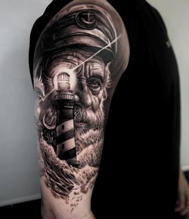 Realism captain lighthouse tattoo by @hermit_ttt