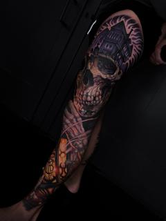 Realism skull and castle tattoo by @honey.scarheart