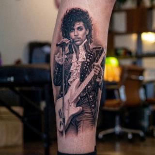 Realism musician portrait tattoo by @inalbersekov