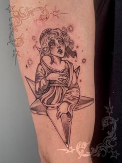Blackwork angelic figure tattoo by @dollmadaki.tattoos