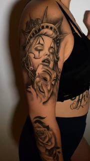 Realism statue liberty woman tattoo by @jaimikotattoo