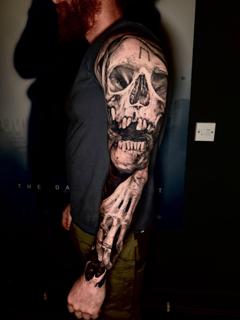 Realism skull sleeve tattoo by @jim.tat