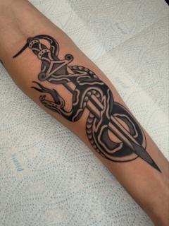Traditional snake dagger tattoo by @joegarey_tattoo