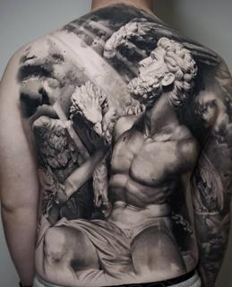 Realism angelic statue tattoo by @jordanferristattoo