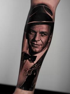 Realism portrait with hat tattoo by @jordanferristattoo