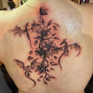 Fine line floral dragons tattoo by @j_c_tattoos