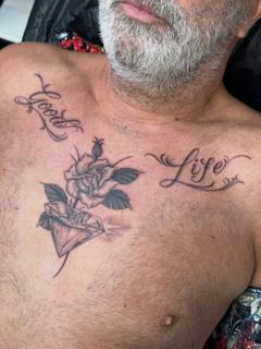 Blackwork rose and diamond tattoo by @katcorneytattoo