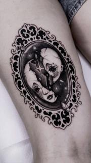 Dark illustrative shattered doll face tattoo by @achlys.ttt