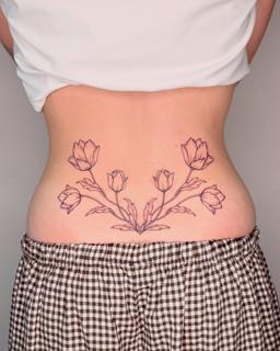 Fine line floral design tattoo by @nevermind.tattoos