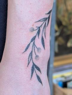 Fine line botanical branch tattoo by @kellyneedles