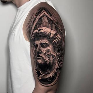 Realism classical statue tattoo by @lazaros_brone