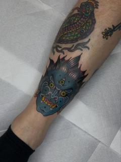 Traditional demon mask tattoo by @no.karate.in.the.pit