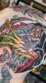 Traditional wizard casting spell tattoo by @lewismckechnie