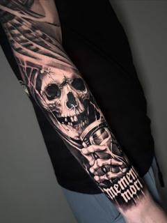 Realism skull with hourglass tattoo by @ladylia_art