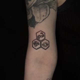 Geometric hexagonal symbols tattoo by @luisjtattoos