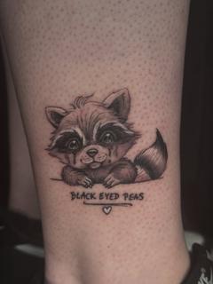 Illustrative crying raccoon tattoo by @luisjtattoos