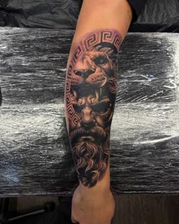 Realism lion and zeus tattoo by @lukaszmtattoo
