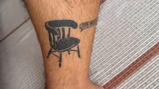 Blackwork chair speech bubble tattoo by @atsoumpeli