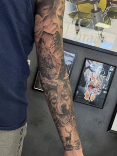 Realism mountain wolf deer tattoo by @mads.flugt