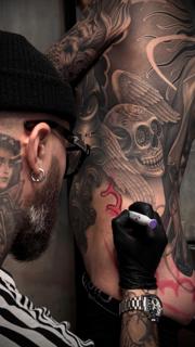 Realism winged skull tattoo by @maksimprimo