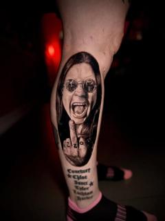 Realism rockstar portrait tattoo by @manic.tatts