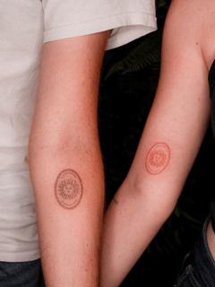 Fine line sun face tattoo by @katerinedovasink