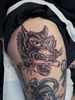Traditional wolf head tattoo by @not_cultured_tattoo