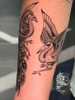 Blackwork phoenix and crane tattoo by @marcelclaude.tattoo