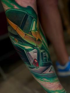 Anime robot helmet tattoo by @marcusottner