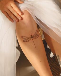 Fine line dragonfly tattoo by @marditattoo