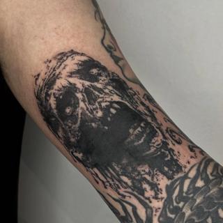 Blackwork zombie face tattoo by @mazira.tattoos