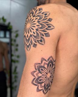 Dotwork mandala flowers tattoo by @garagetattooshop