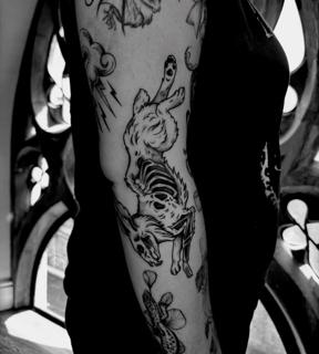 Blackwork skeleton rabbit tattoo by @mariamanzitattoo