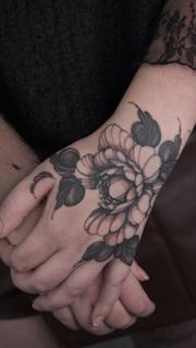 Blackwork floral bloom tattoo by @marisatattooartist