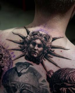 Realism classical sun face tattoo by @markwosgerau