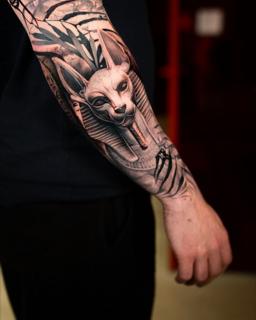 Realism egyptian cat god tattoo by @markwosgerau