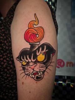 American traditional flaming panther head tattoo by @marthmallow.tatts