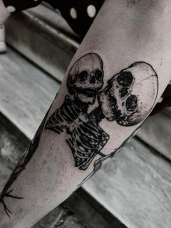 Blackwork conjoined skeletons tattoo by @matina_macabre_tatt