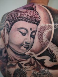 Realism buddha portrait tattoo by @max_wood_art