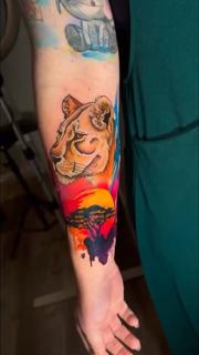Illustrative realism lioness savannah sunset tattoo by @meg.tattz
